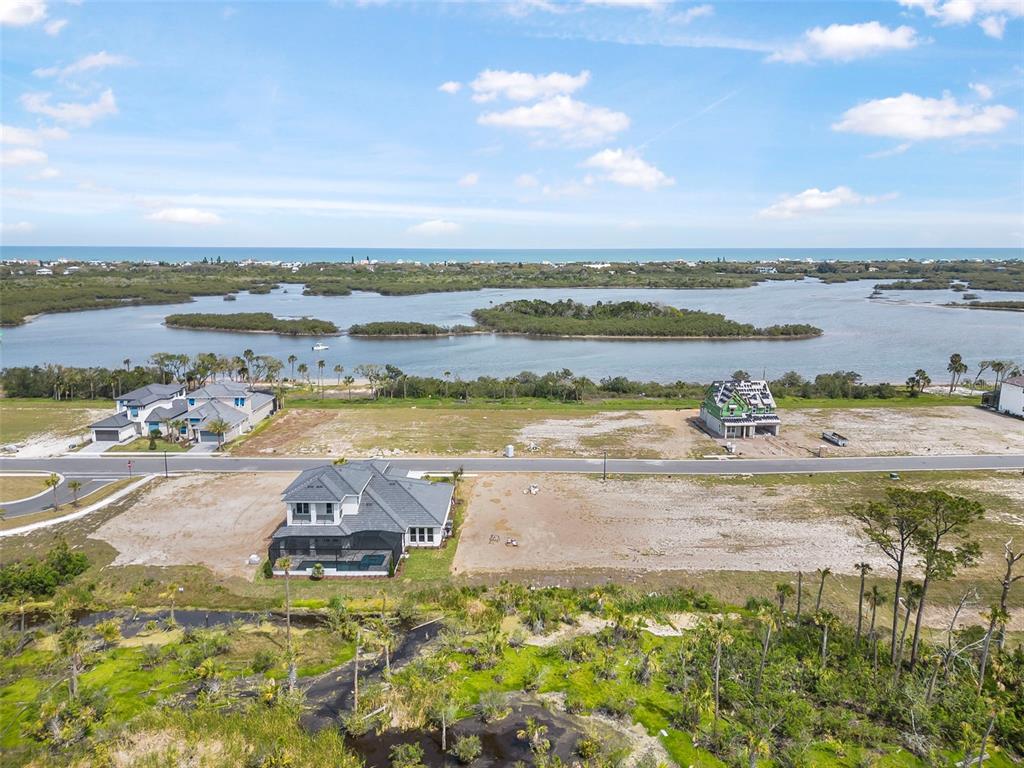 53 Coronado Road Flagler Beach, FL 32136 - Photo 21 of 29 a view of a lake with houses in the back