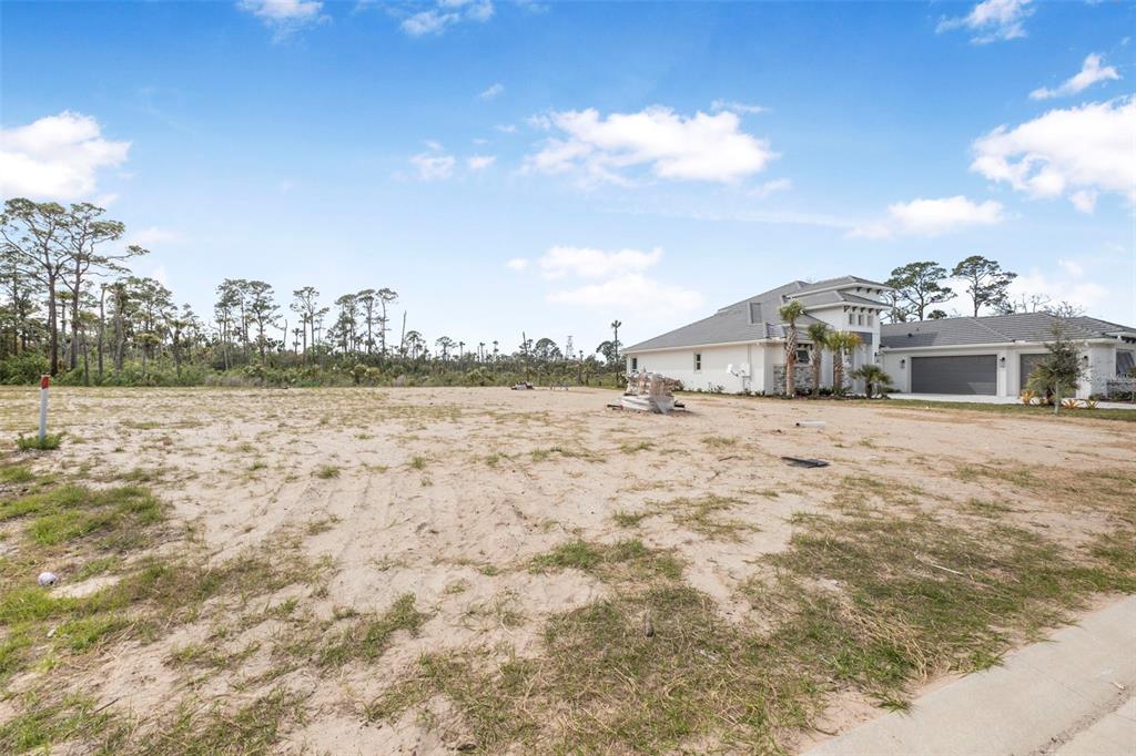 53 Coronado Road Flagler Beach, FL 32136 - Photo 25 of 29 a view of a house with a yard