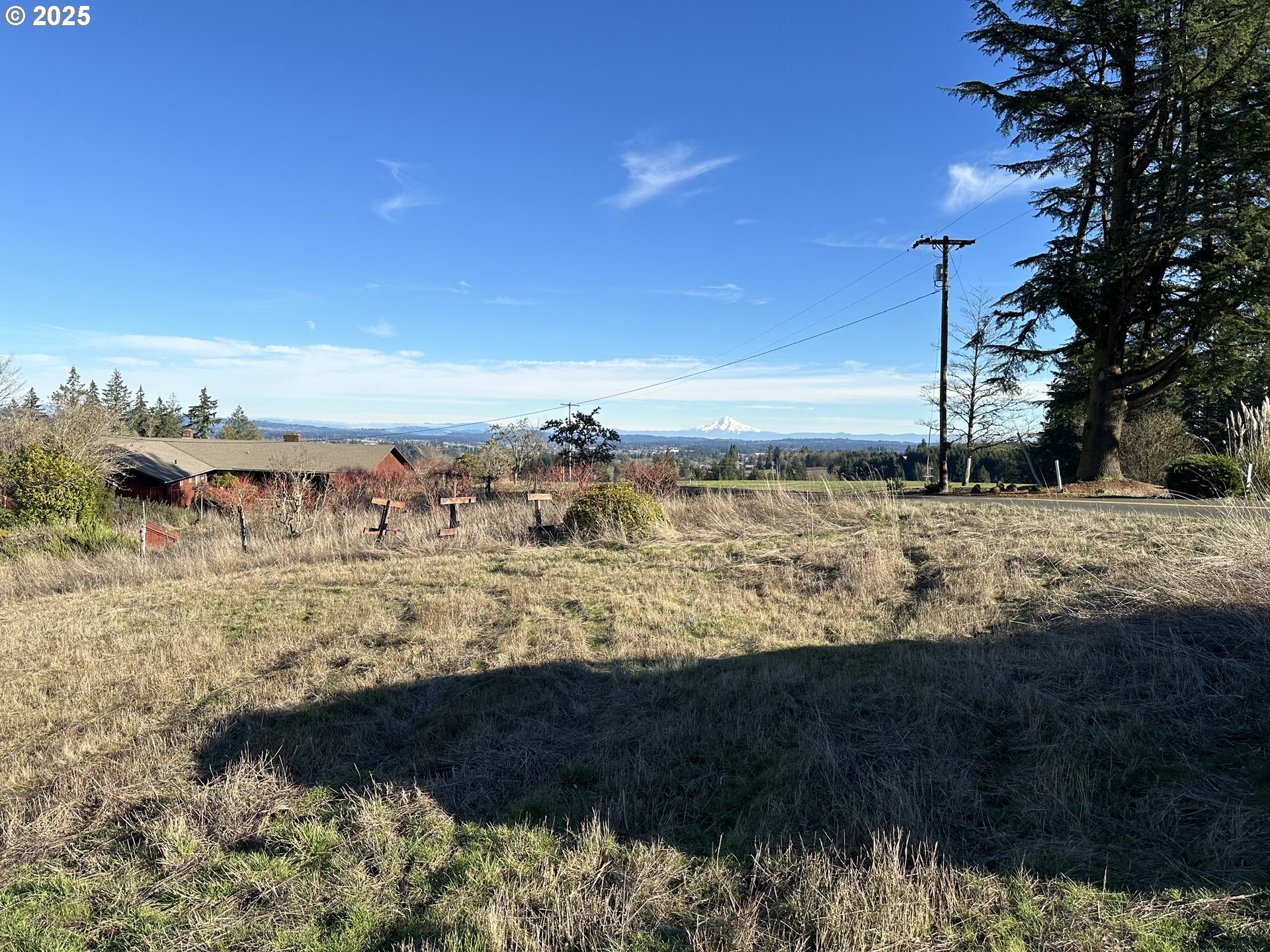 21007 Southwest Kruger Road Sherwood, OR 97140 - Photo 2 of 18 a view of large body of water with lots of trees in background
