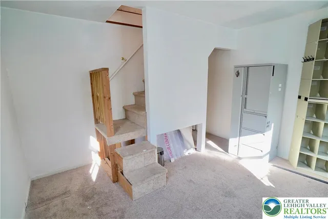 a view of a hallway with staircase