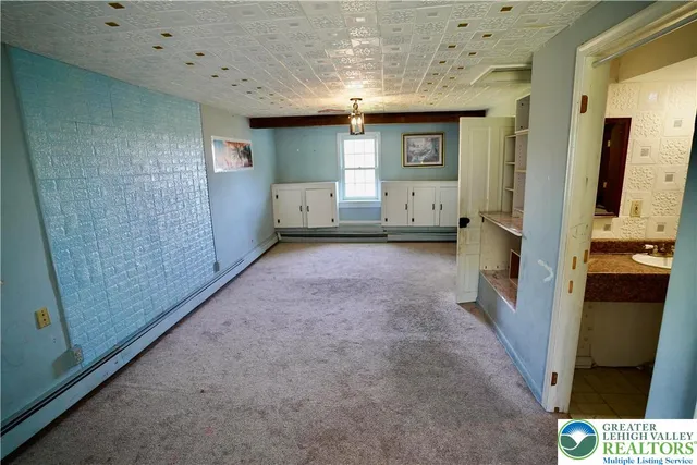 a view of a backyard with sitting area