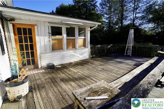 a bathroom with shower and window