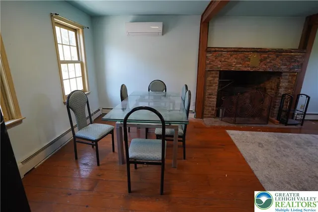 a view of a livingroom with furniture and a fireplace