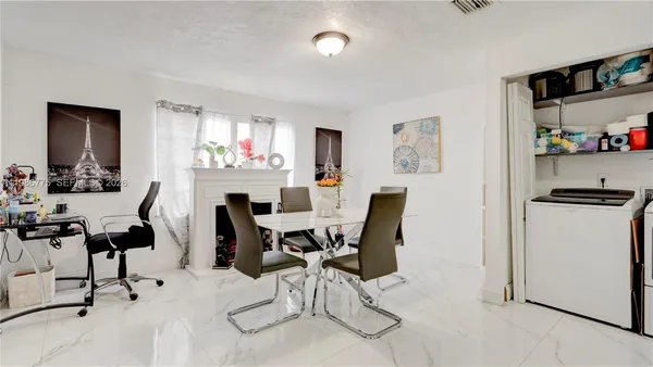 a view of a dining room with furniture