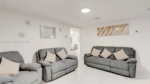 a living room with furniture and a couch