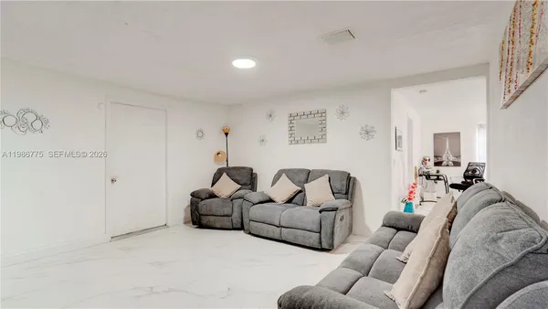a living room with furniture and a couch