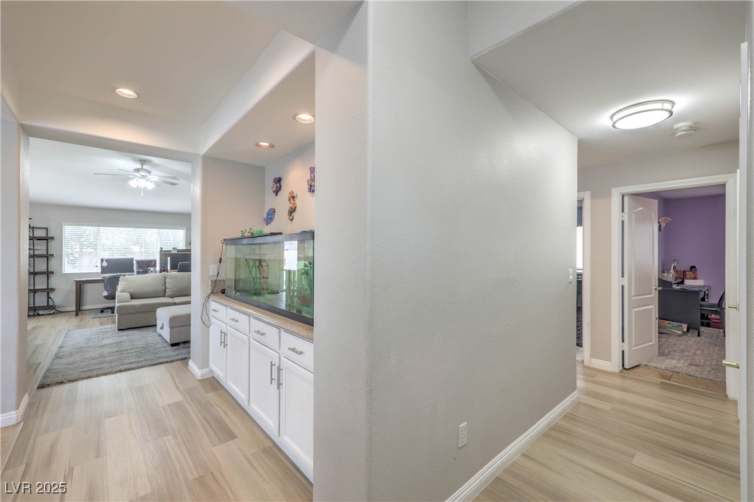 47 Trailside Court Henderson, NV 89012 - Photo 3 of 26 Hallway featuring light wood-style flooring and recessed lighting