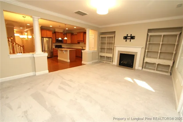 a view of kitchen with furniture and a fireplace