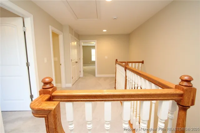 a view of a hallway with staircase