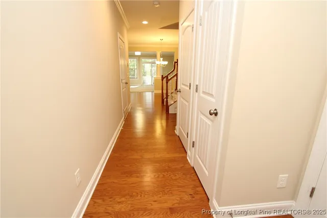 a view of a hallway with a white door