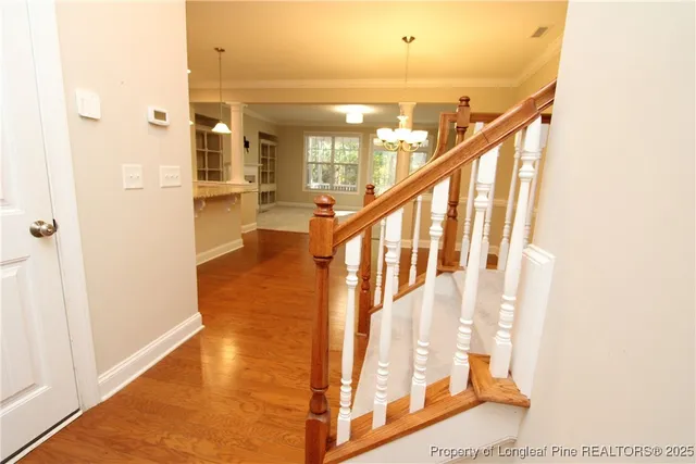a view of an entryway with wooden floor