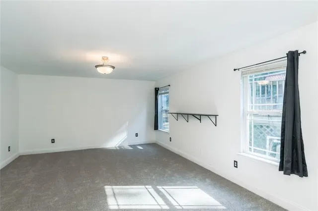 a view of empty room with windows