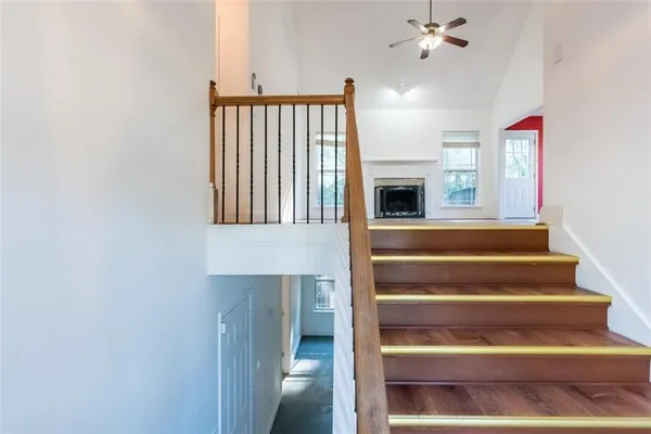 a view of entryway and hall with wooden floor