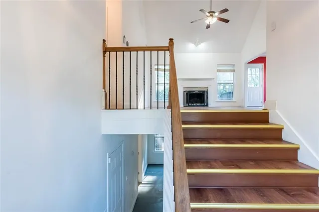 a view of entryway and hall with wooden floor
