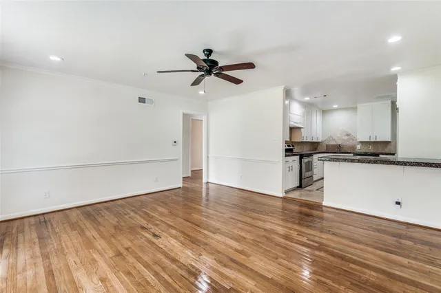 a view of a kitchen with a dishwasher and a stove top oven