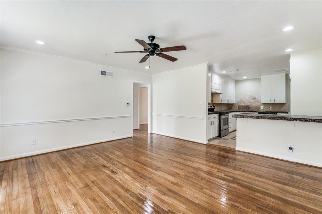 529 Roberts Cut Off Road River Oaks, TX 76114 - Photo 1 of 12 Unfurnished living room with light wood-type flooring, crown molding, recessed lighting, and a ceiling fan