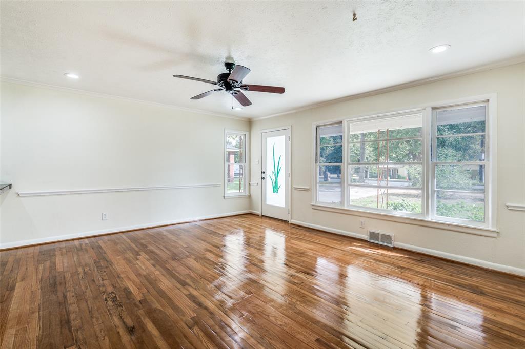 529 Roberts Cut Off Road River Oaks, TX 76114 - Photo 3 of 12 Empty room featuring crown molding, wood-type flooring, ceiling fan, and recessed lighting