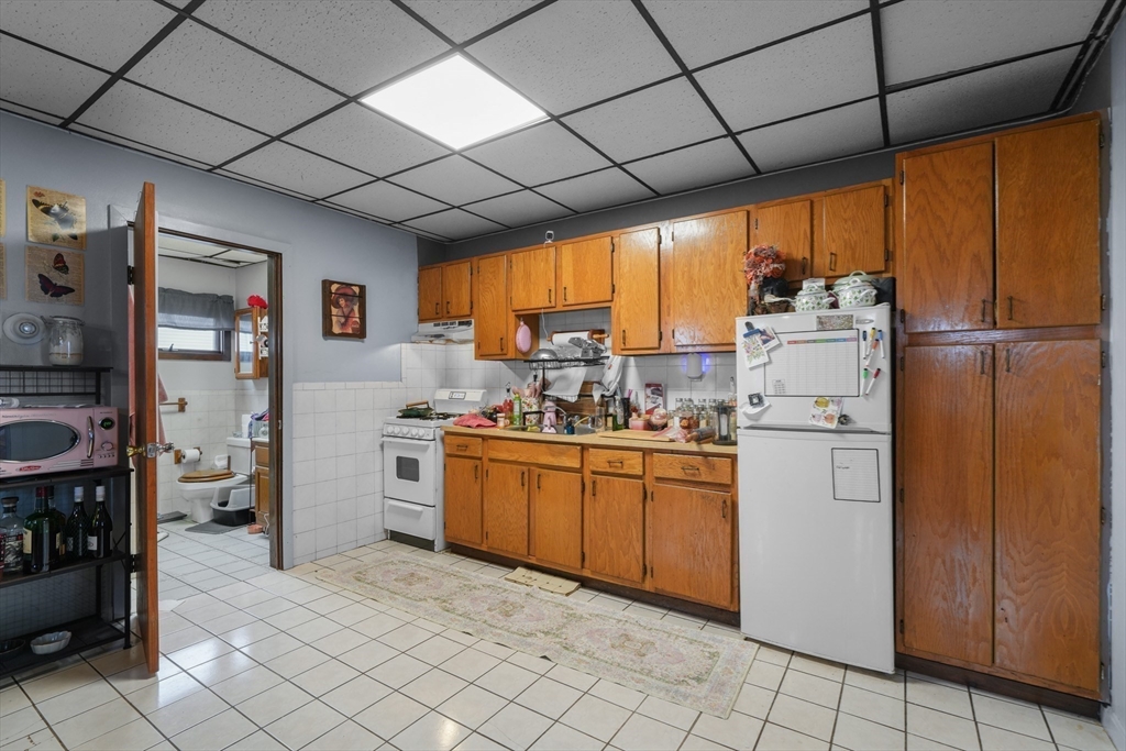 337 Columbia Street Fall River, MA 02721 - Photo 14 of 33 a kitchen with appliances cabinets and furniture