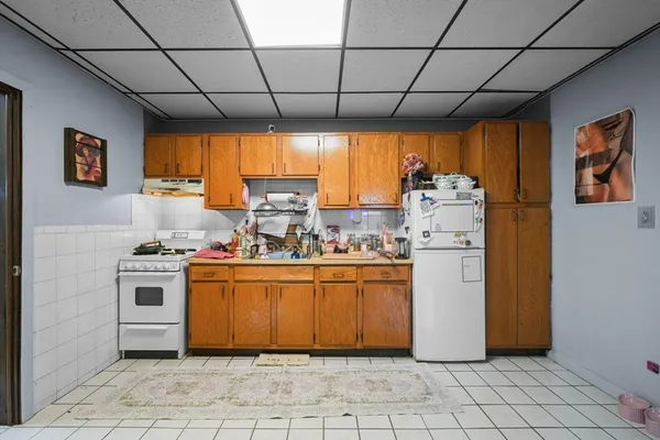 a kitchen with refrigerator and countertop