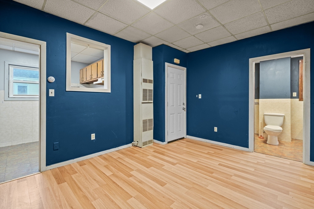 337 Columbia Street Fall River, MA 02721 - Photo 21 of 33 a bedroom with a bed and a painting on the wall