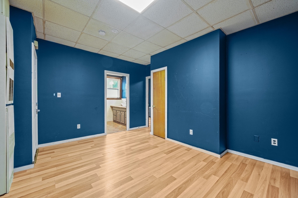 337 Columbia Street Fall River, MA 02721 - Photo 22 of 33 a view of empty room with wooden floor