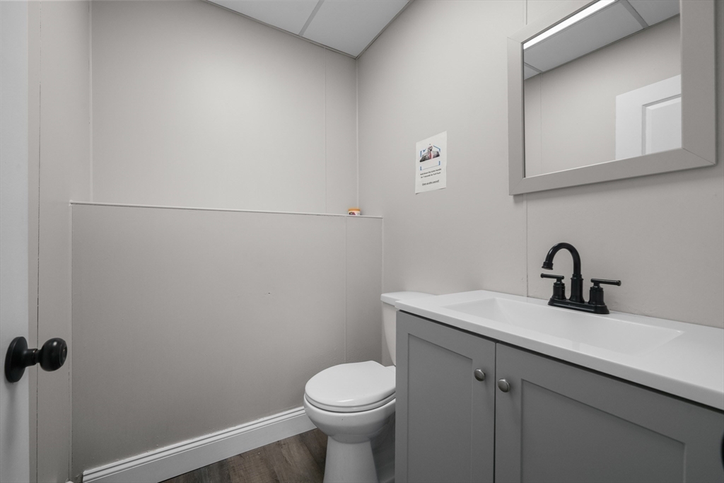337 Columbia Street Fall River, MA 02721 - Photo 8 of 33 a bathroom with a sink toilet and a mirror