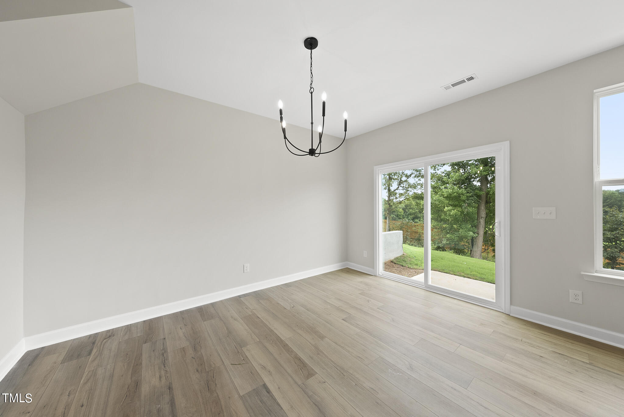 68 Ripple Way, Unit 309 Clayton, NC 27520 - Photo 9 of 39 Dining area with slider to sun patio