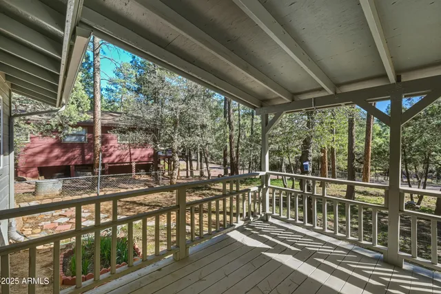a view of a porch with wooden floor