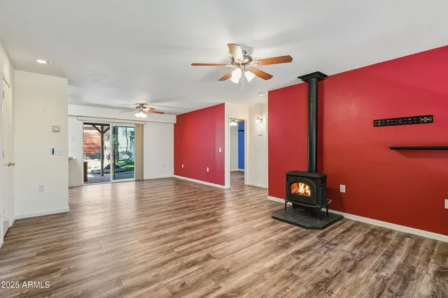 a view of livingroom with hardwood floor and ceiling fan