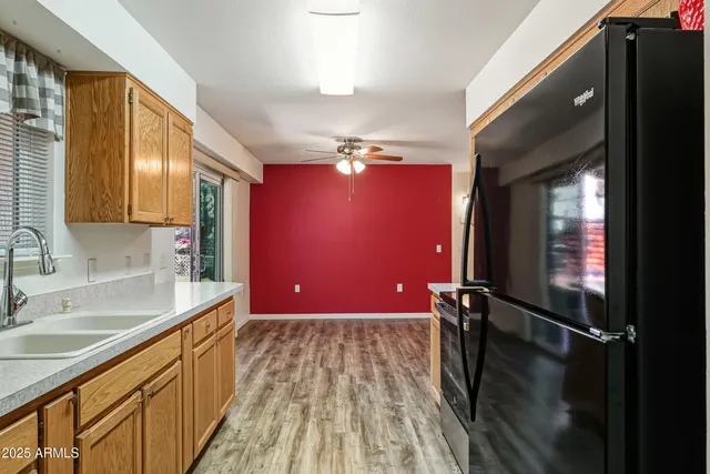 a bathroom with a sink vanity granite tub shower and a mirror