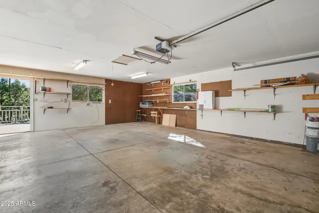 a view of a livingroom with furniture and a kitchen