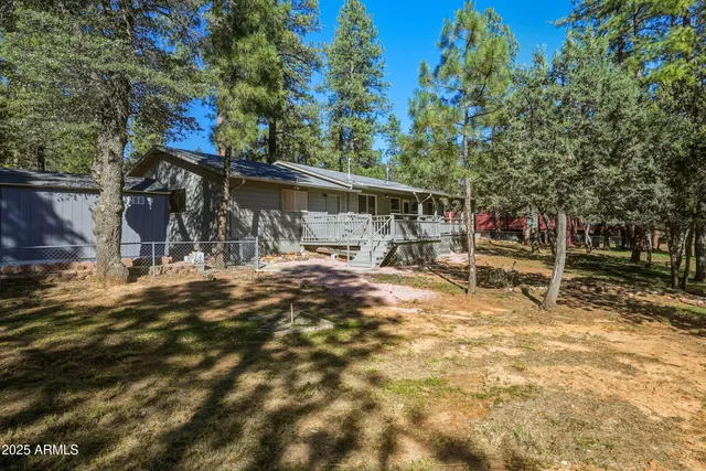 a view of a tree in front of a house