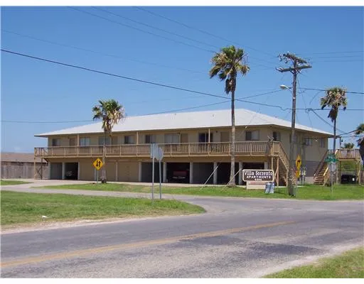 a view of a building with a garden area