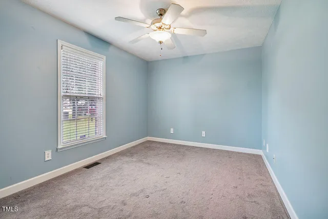 a bathroom with a granite countertop sink a toilet and a bathtub