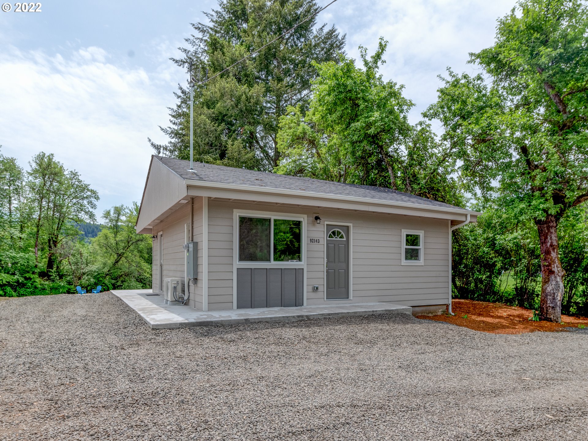 92143 Marcola Road Marcola, OR 97454 - Photo 1 of 27 a view of a house with a yard and large tree