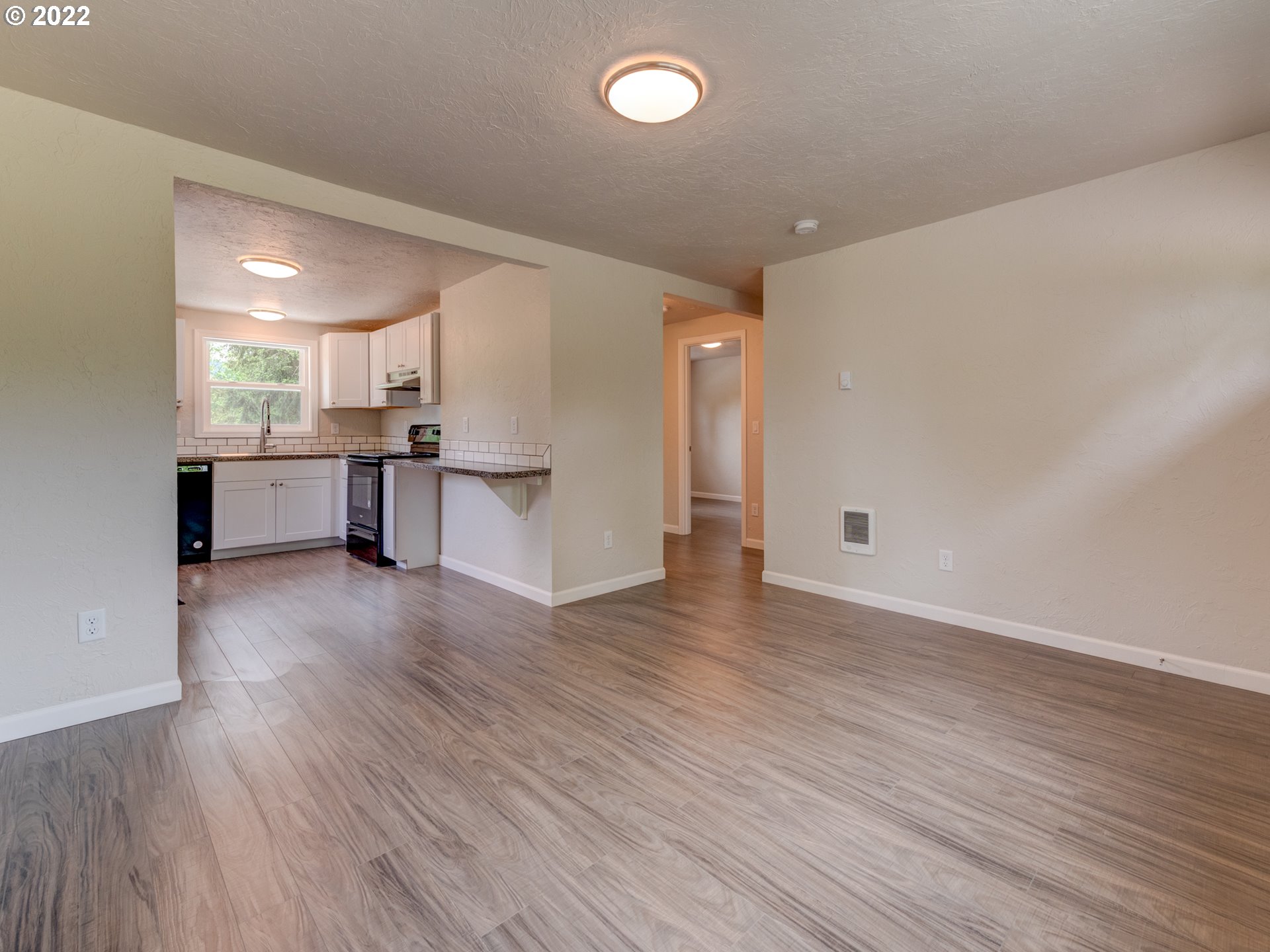 92143 Marcola Road Marcola, OR 97454 - Photo 9 of 27 a view of a kitchen with cabinets and wooden floor
