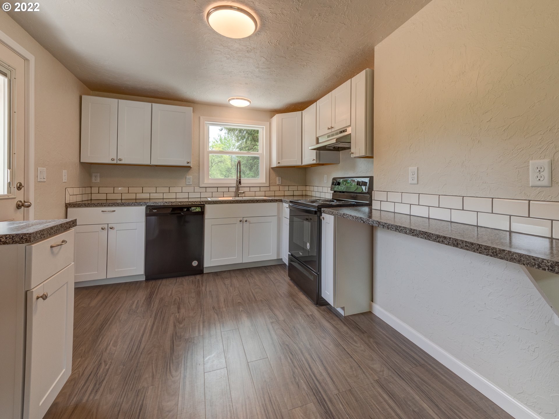 92143 Marcola Road Marcola, OR 97454 - Photo 10 of 27 a kitchen with stainless steel appliances granite countertop wooden cabinets a sink dishwasher a stove and a refrigerator