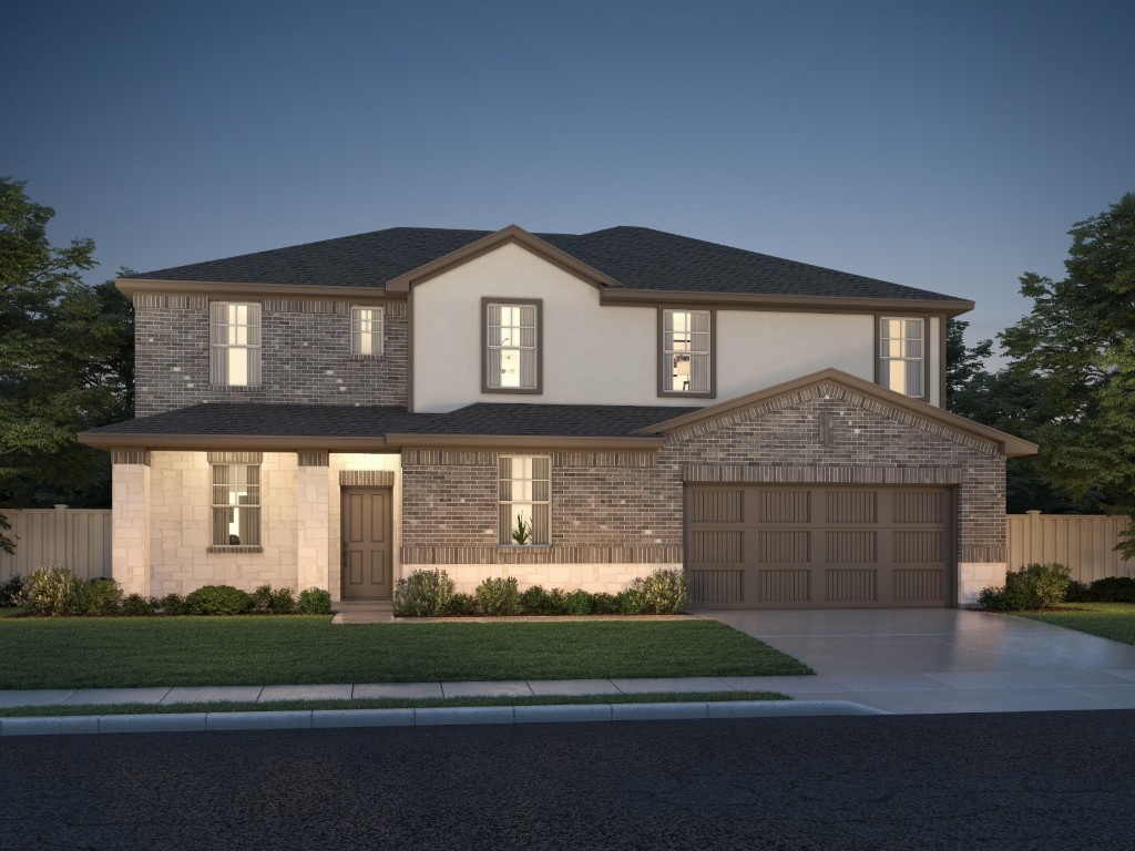 522 Sue Peaks Loop Dripping Springs, TX 78620 - Photo 1 of 1 a front view of a house with a garden and garage
