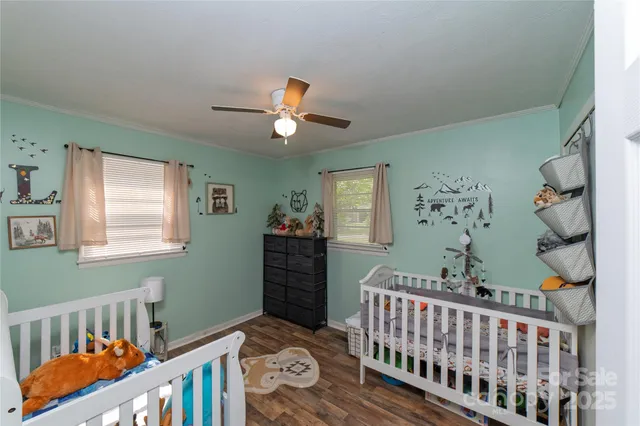 a bedroom with furniture and a window