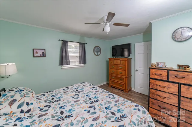 a bedroom with a bed and a dresser in it