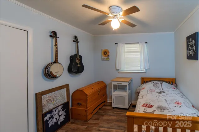 a view of living room with furniture and wooden floor