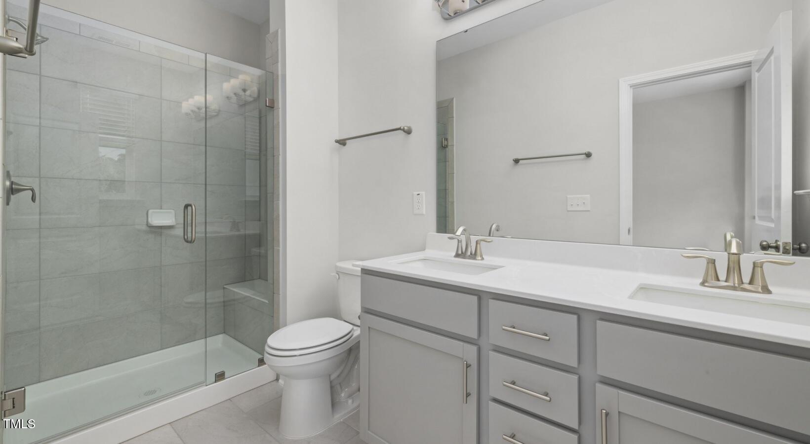 3709 Nova Star Lane, Unit GARRISON Raleigh, NC 27612 - Photo 13 of 30 a bathroom with a sink toilet and shower