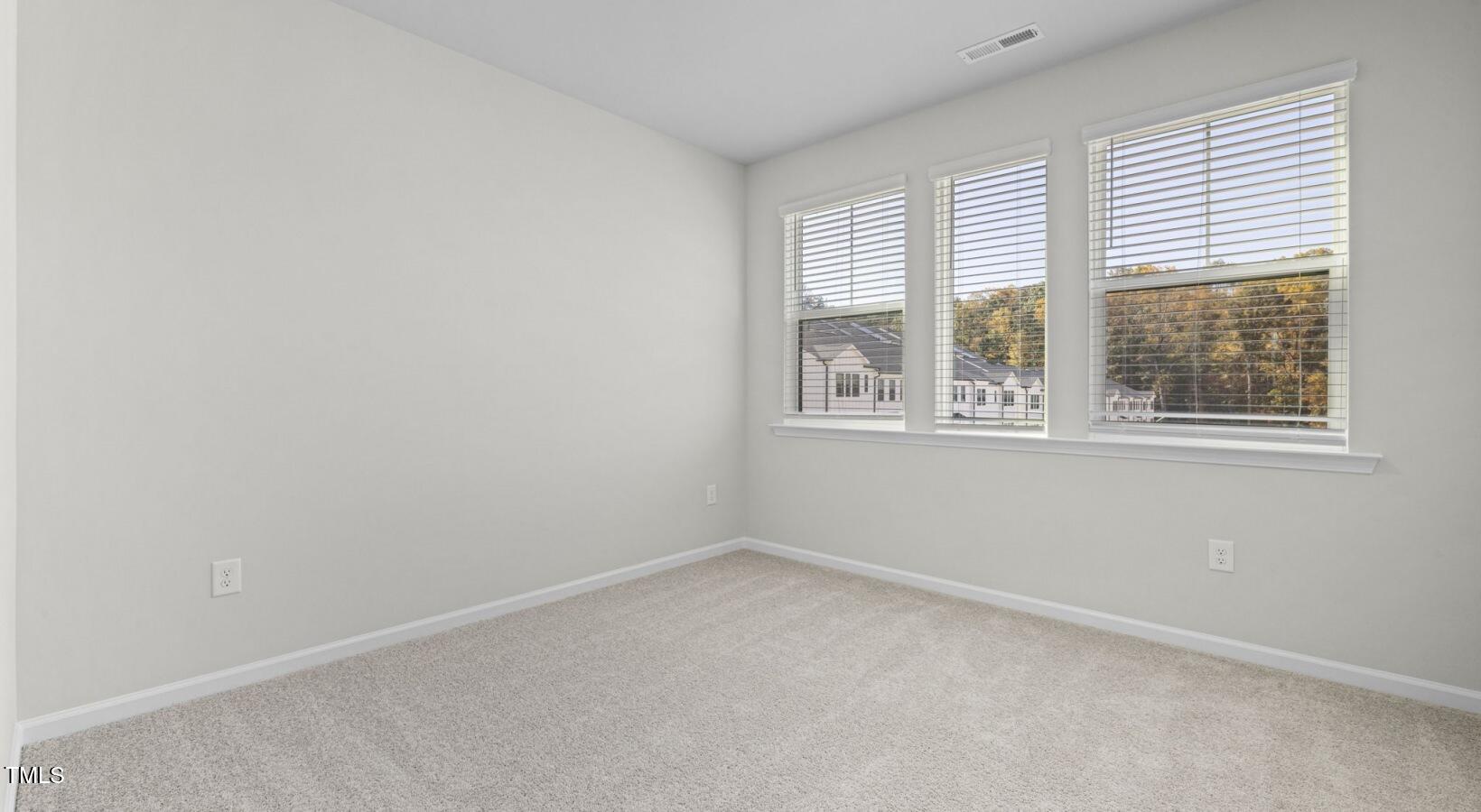 3709 Nova Star Lane, Unit GARRISON Raleigh, NC 27612 - Photo 16 of 30 an empty room with a window