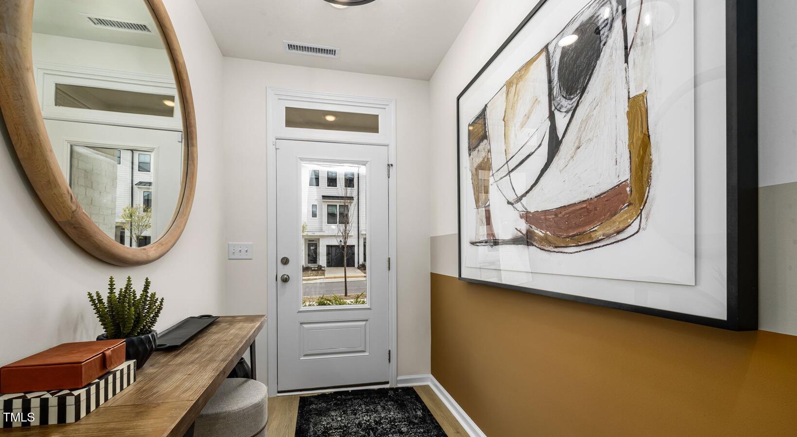 3709 Nova Star Lane, Unit GARRISON Raleigh, NC 27612 - Photo 23 of 30 a bathroom with a sink and a mirror