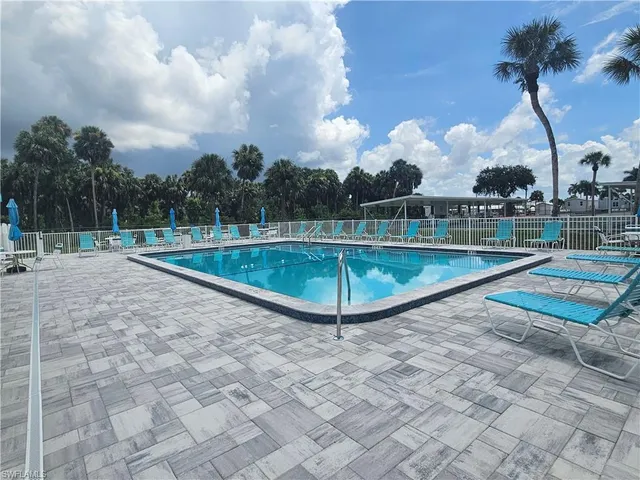 a view of a swimming pool with a yard