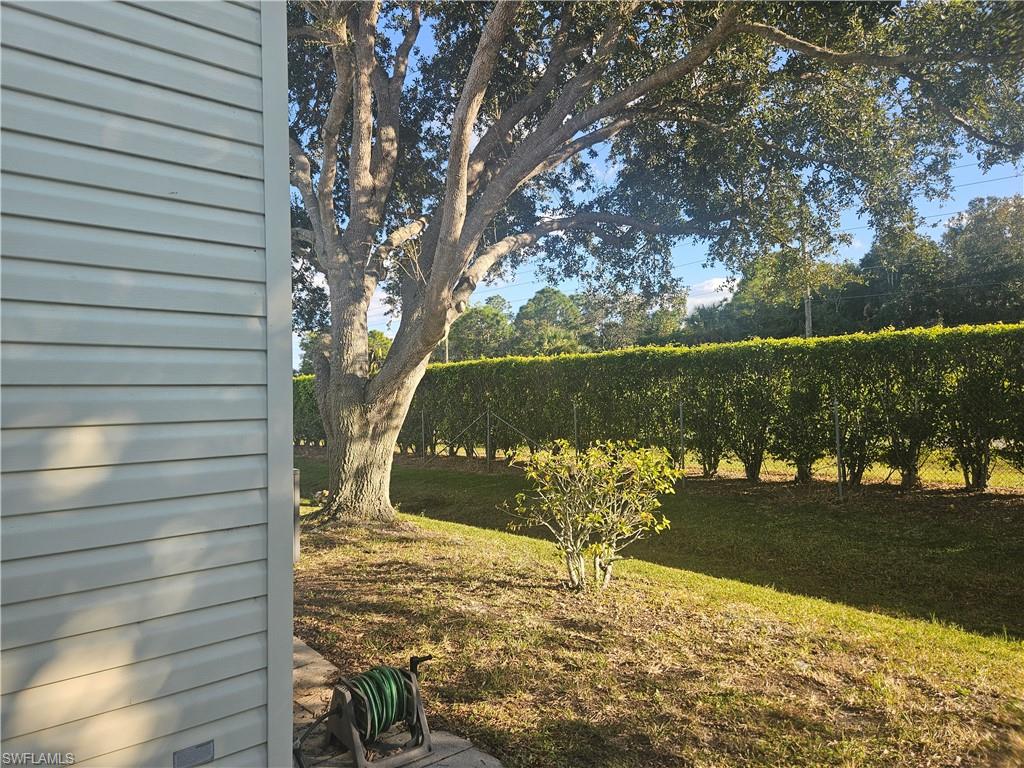 38 Turquoise Avenue, Unit 38T Naples, FL 34114 - Photo 5 of 29 a view of a yard with wooden fence