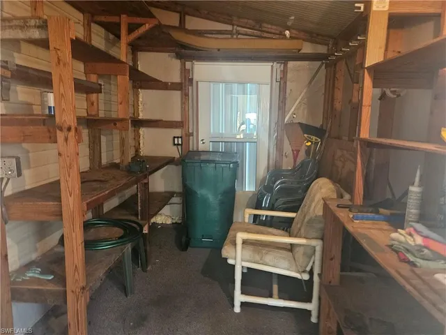 a view of workspace with wooden floor and windows