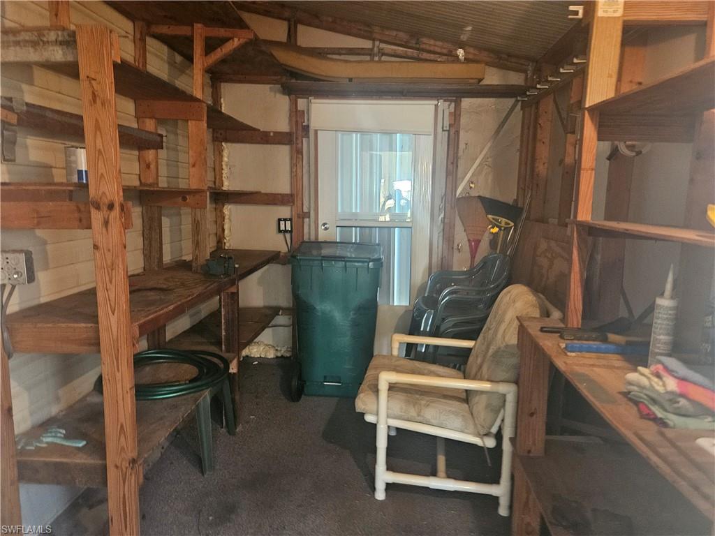 38 Turquoise Avenue, Unit 38T Naples, FL 34114 - Photo 7 of 29 a view of workspace with wooden floor and windows