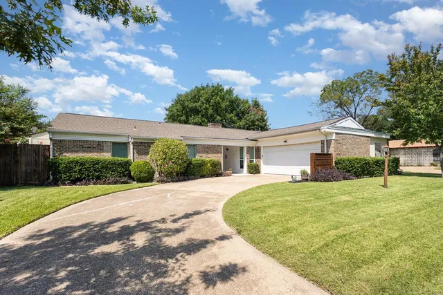 a house view with a garden space