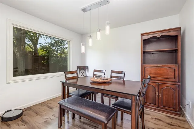 a view of a dining room with furniture window and outside view